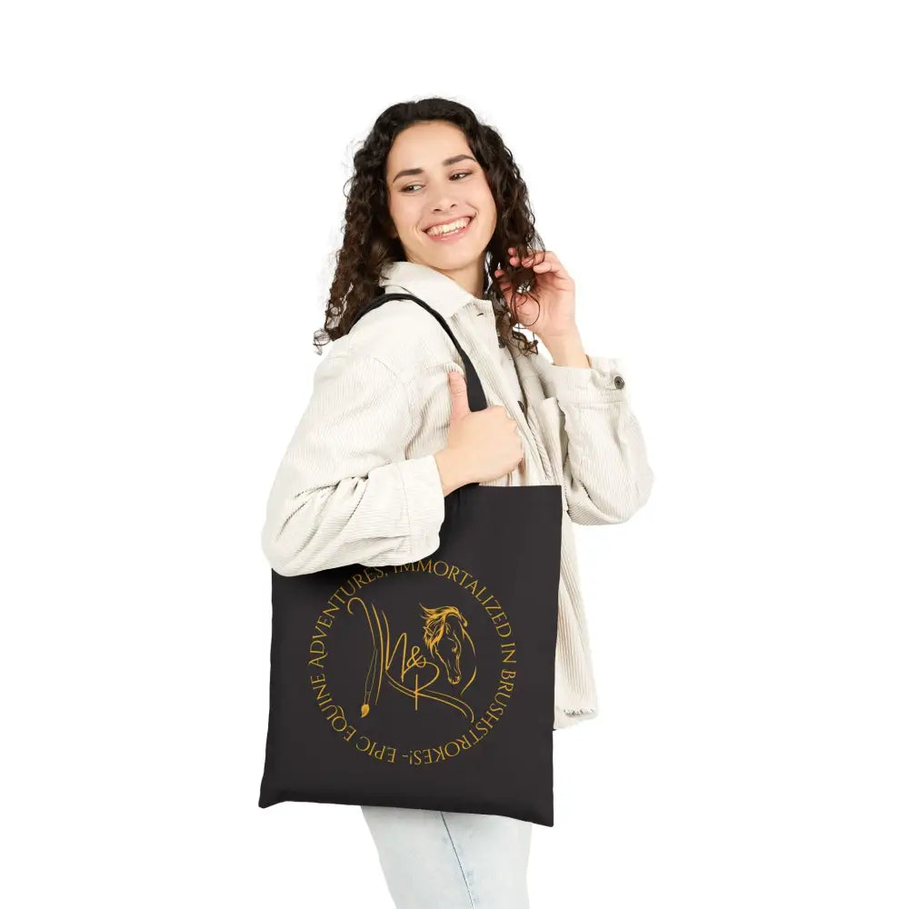Black canvas tote bag with golden horse design and Nadine & Ripley logo