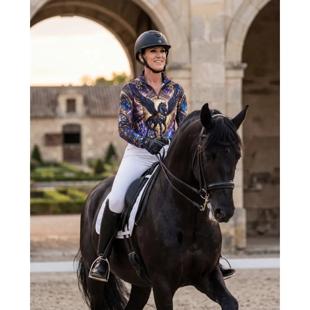 Black horse with glossy coat wearing astral ascension performance equestrian sun shirt and black bridle and saddle