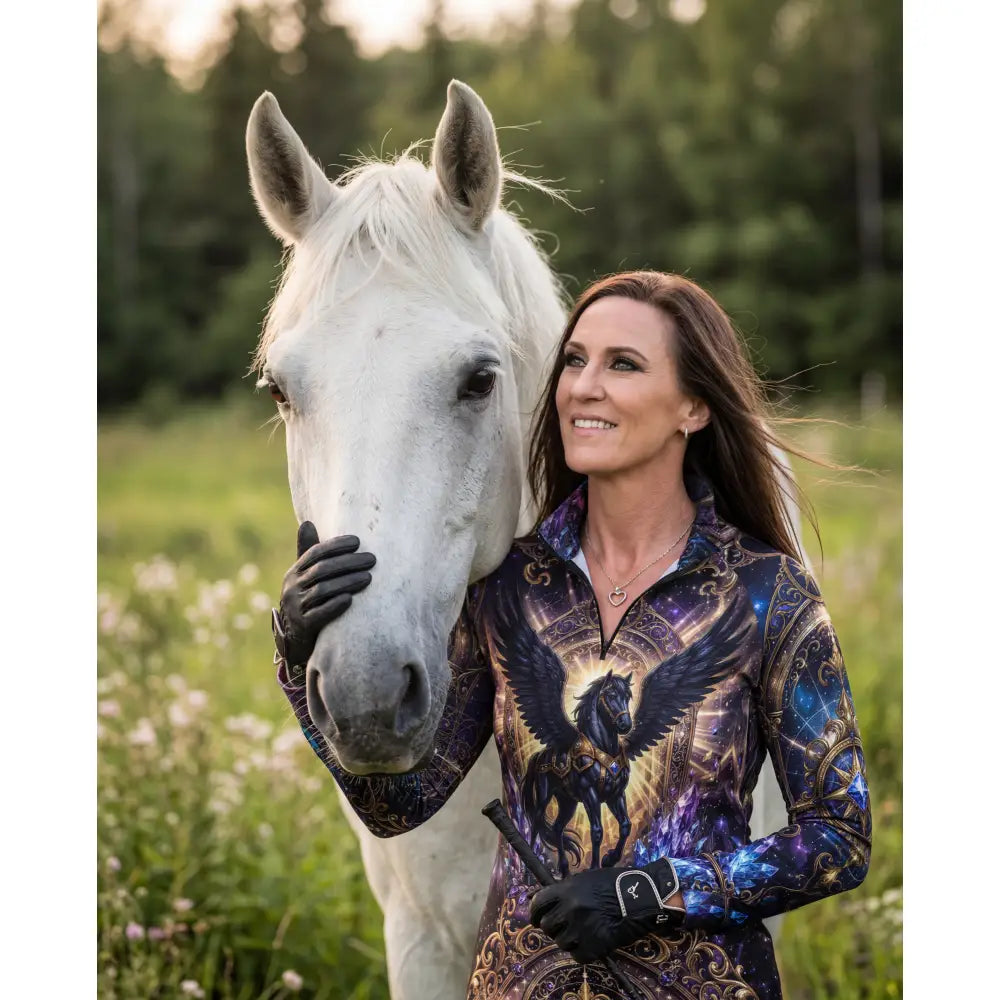 Woman wearing astral ascension performance equestrian sun shirt with galaxy print and ornate black winged horse design