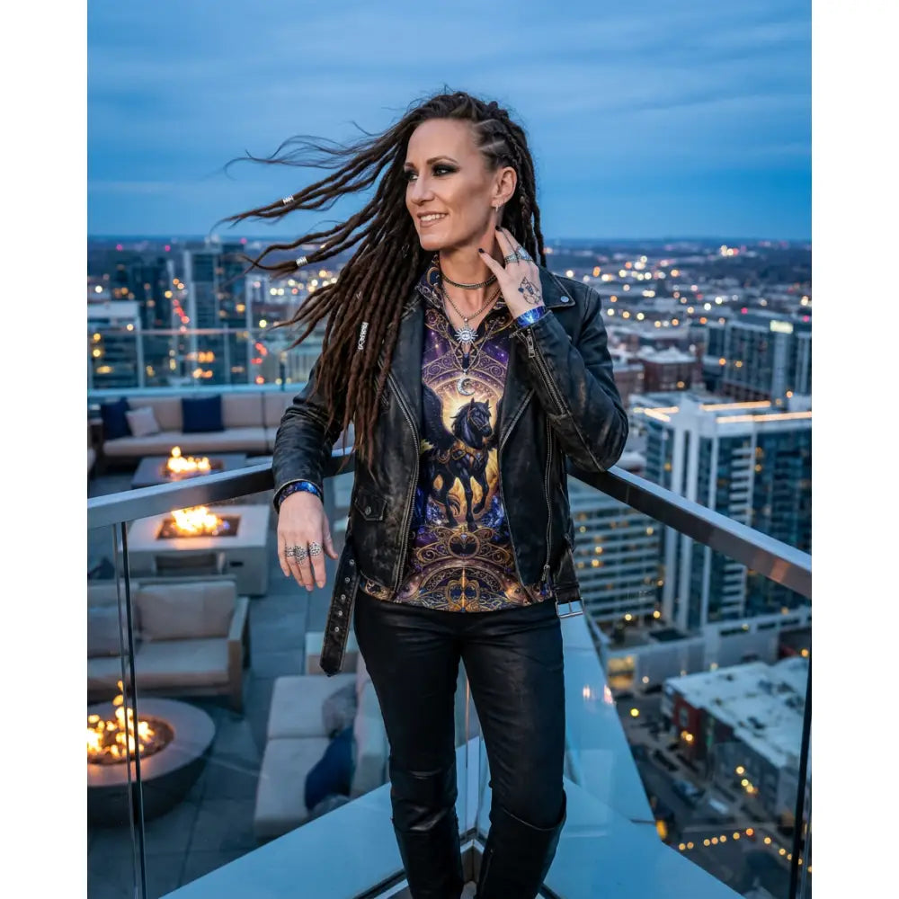 Black leather jacket with studded details and distressed texture paired with astral ascension performance equestrian sun shirt