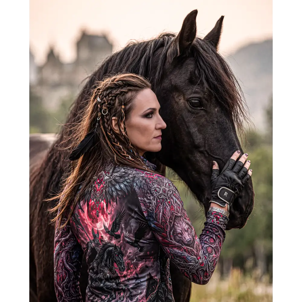 Black horse with glossy coat and flowing mane wearing blood moon hunt performance equestrian sun shirt upf50+
