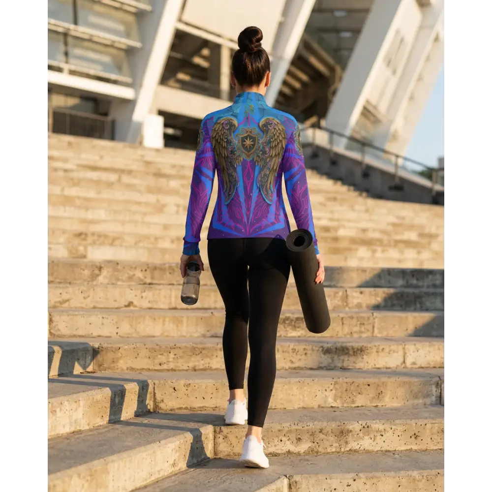 Back view of a vibrant blue and purple performance equestrian sun shirt with angel wing designs and upf50+ protection