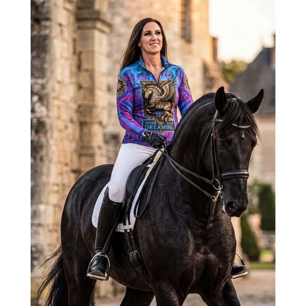 A vibrant purple and blue gradient long-sleeved performance equestrian sun shirt with golden dragon and never stop dreaming text