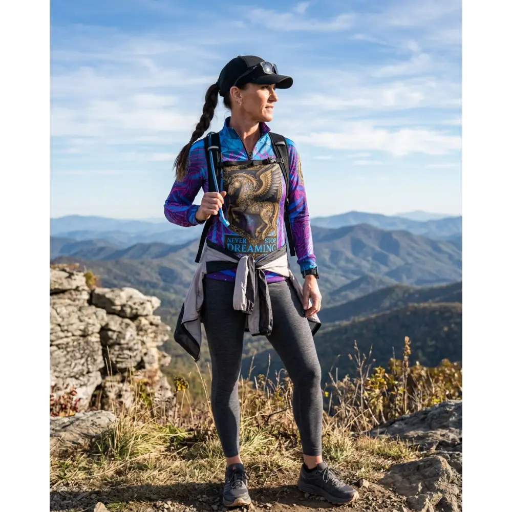 Woman wearing never stop dreaming performance equestrian sun shirt upf50 plus in purple and blue with eagle graphic