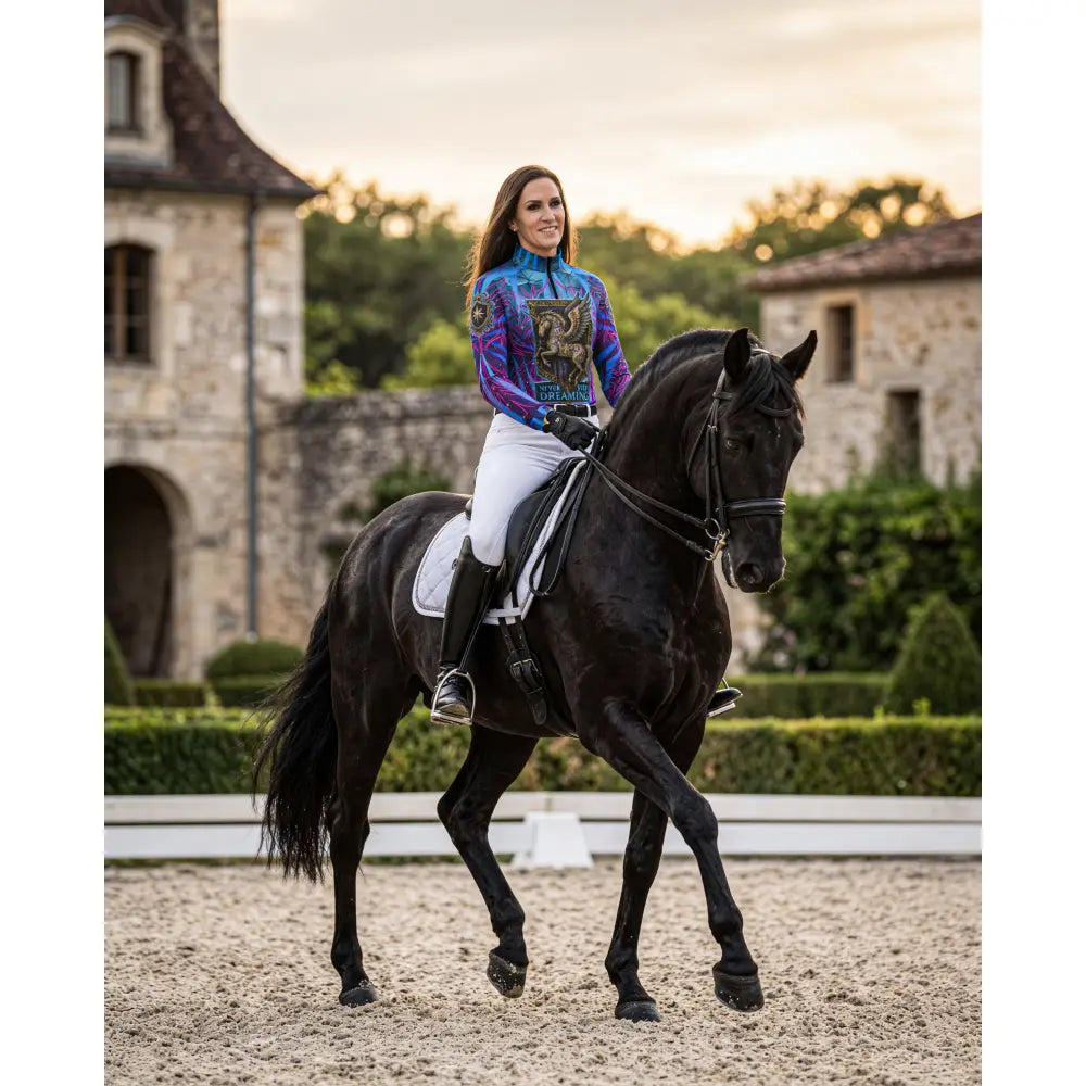 The never stop dreaming performance equestrian sun shirt features a vibrant purple and blue winged horse print with upf50+ protection