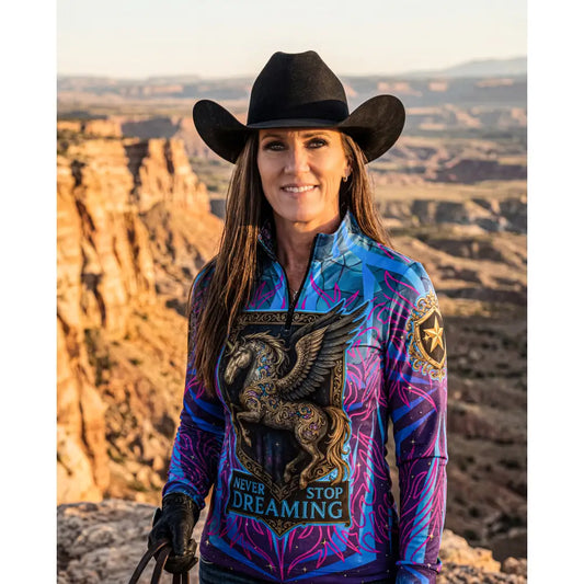 Vibrant blue and purple long-sleeved equestrian sun shirt with winged horse print and never stop dreaming text