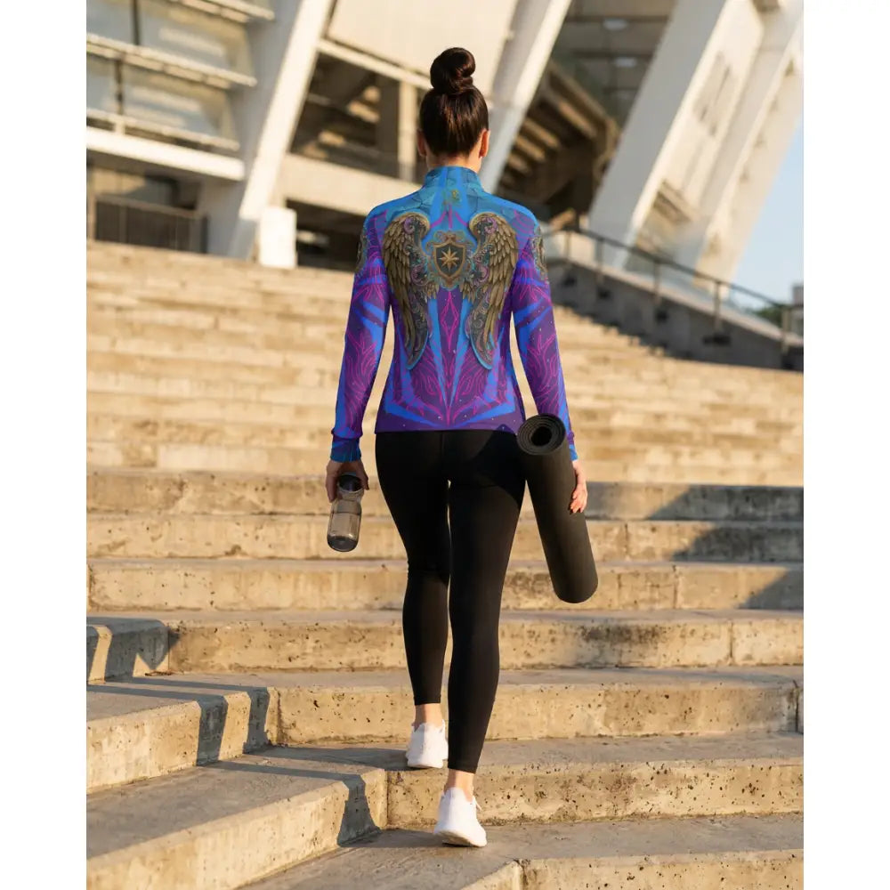 Back of a vibrant blue and purple long-sleeved performance equestrian sun shirt with intricate angel wing design