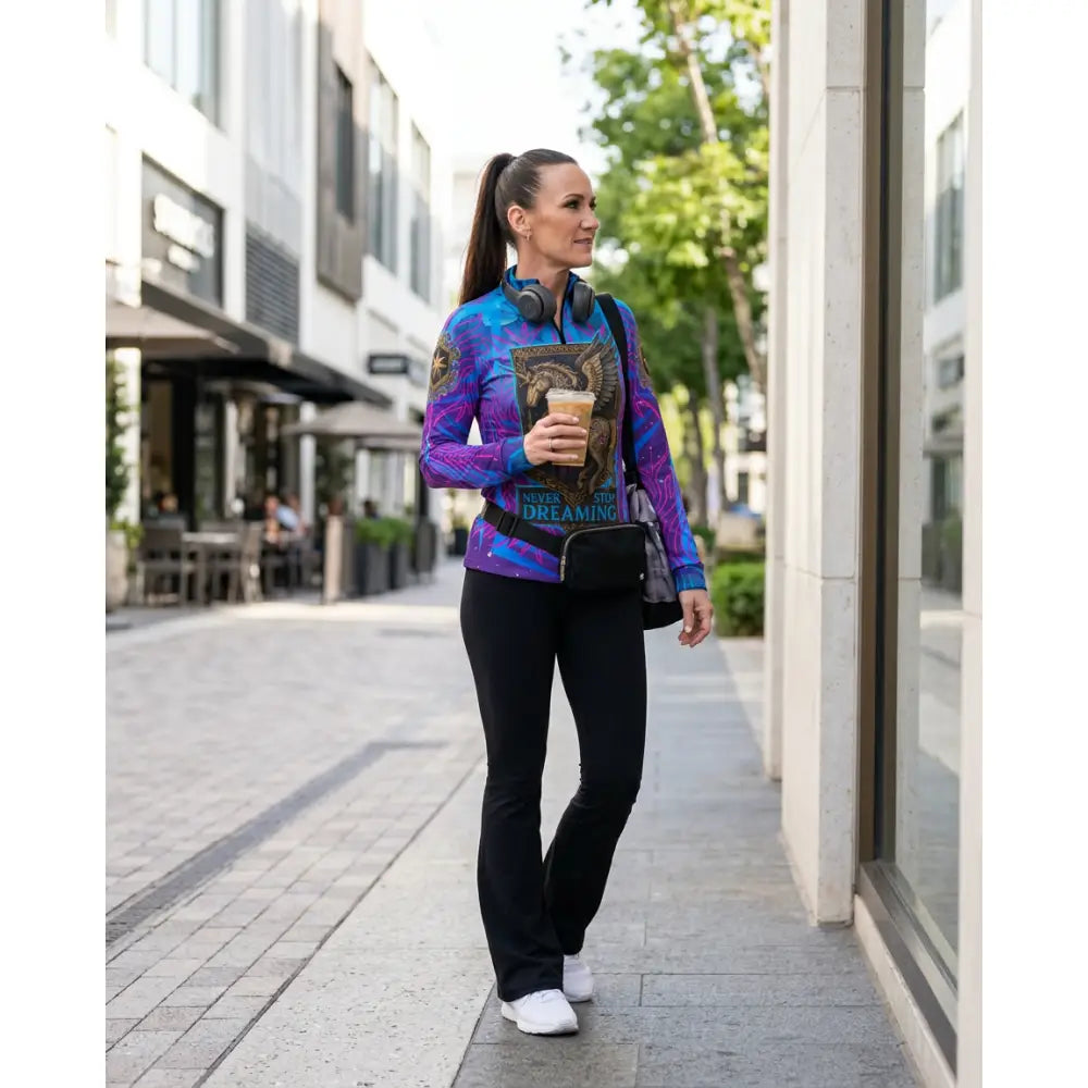 A vibrant purple and blue performance equestrian sun shirt with owl and coffee cup graphic stop dreaming design