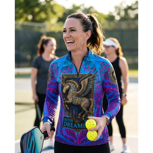 Vibrant blue and purple long-sleeved performance equestrian sun shirt with golden winged horse and never stop dreaming text