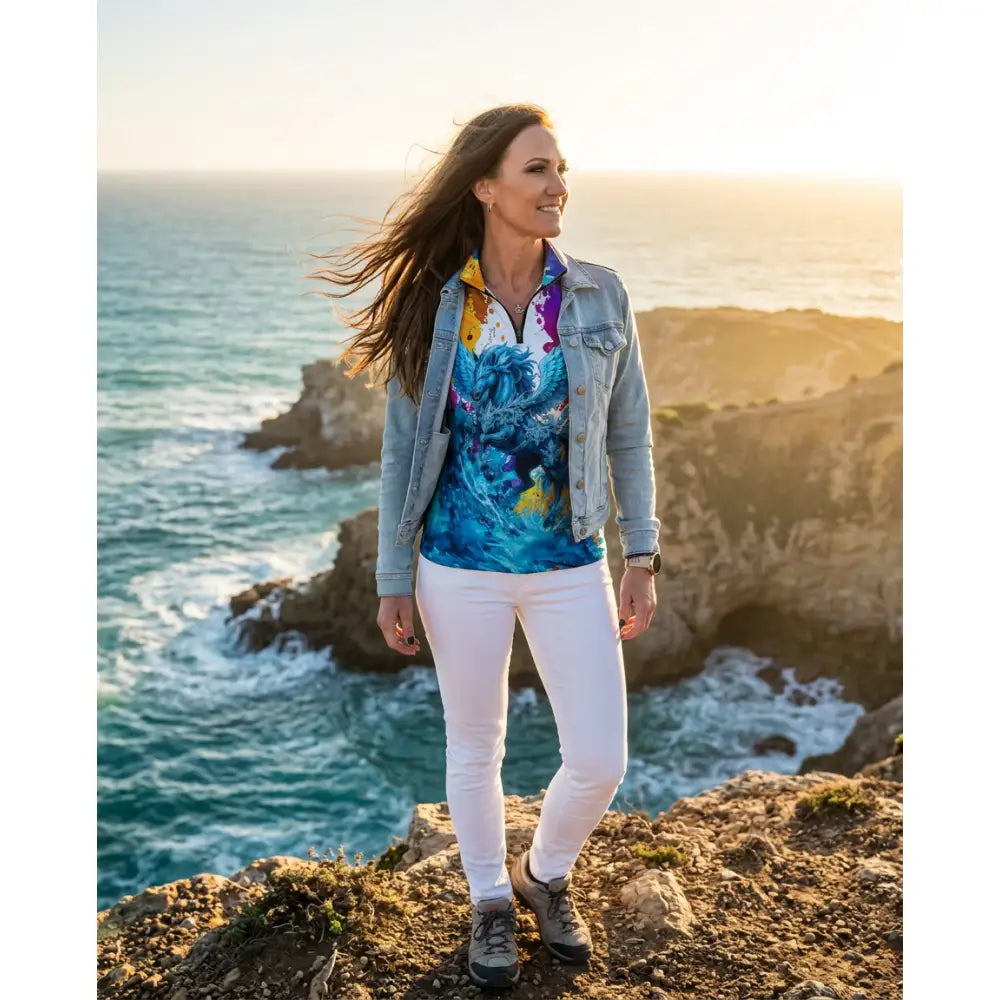 Woman wearing riptide radiance equestrian sun shirt in blue and yellow floral print from ripley signature collection wearable art