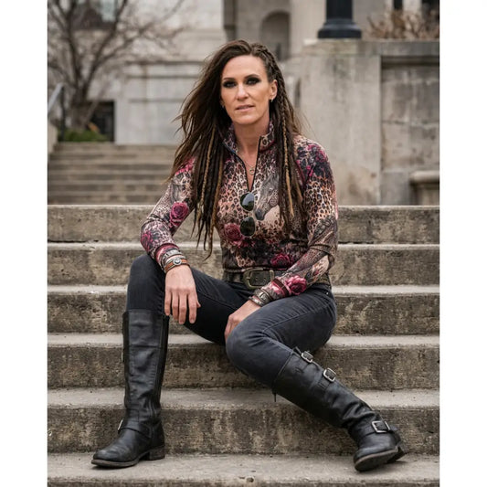 Black leather knee-high boots with silver buckles paired with rosae equiferus equestrian sun shirt by karen reinertson