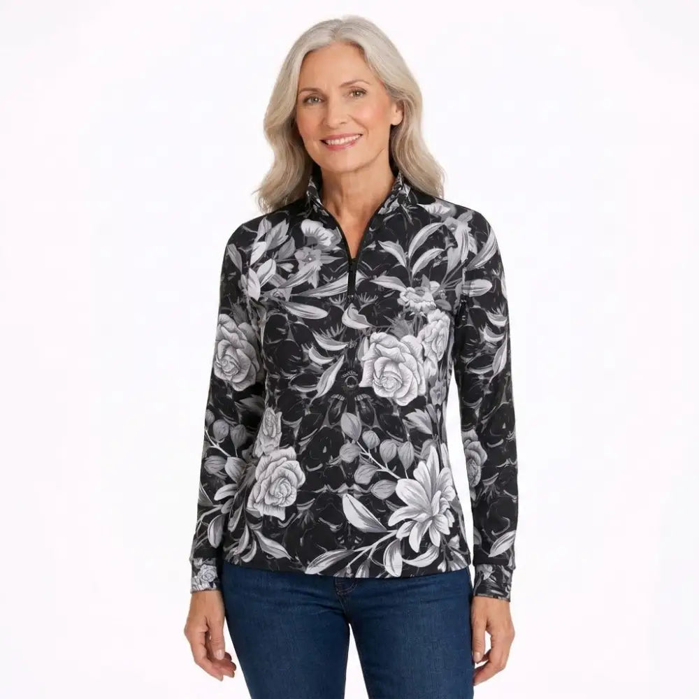 Black long-sleeved quarter-zip performance equestrian sun shirt with grayscale floral pattern and upf50+ sun protection