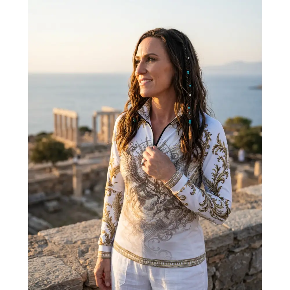White long-sleeved zip-up solis aeternum performance equestrian sun shirt with gold and gray ornate phoenix design upf50+