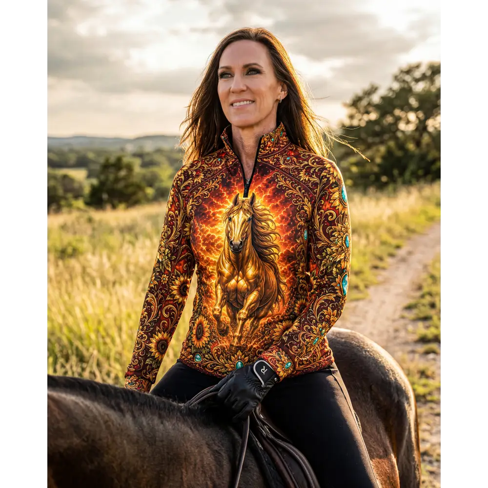 A vibrant long-sleeved zip-up sun shirt with golden horse design and fiery patterns in sunfire sovereign colors