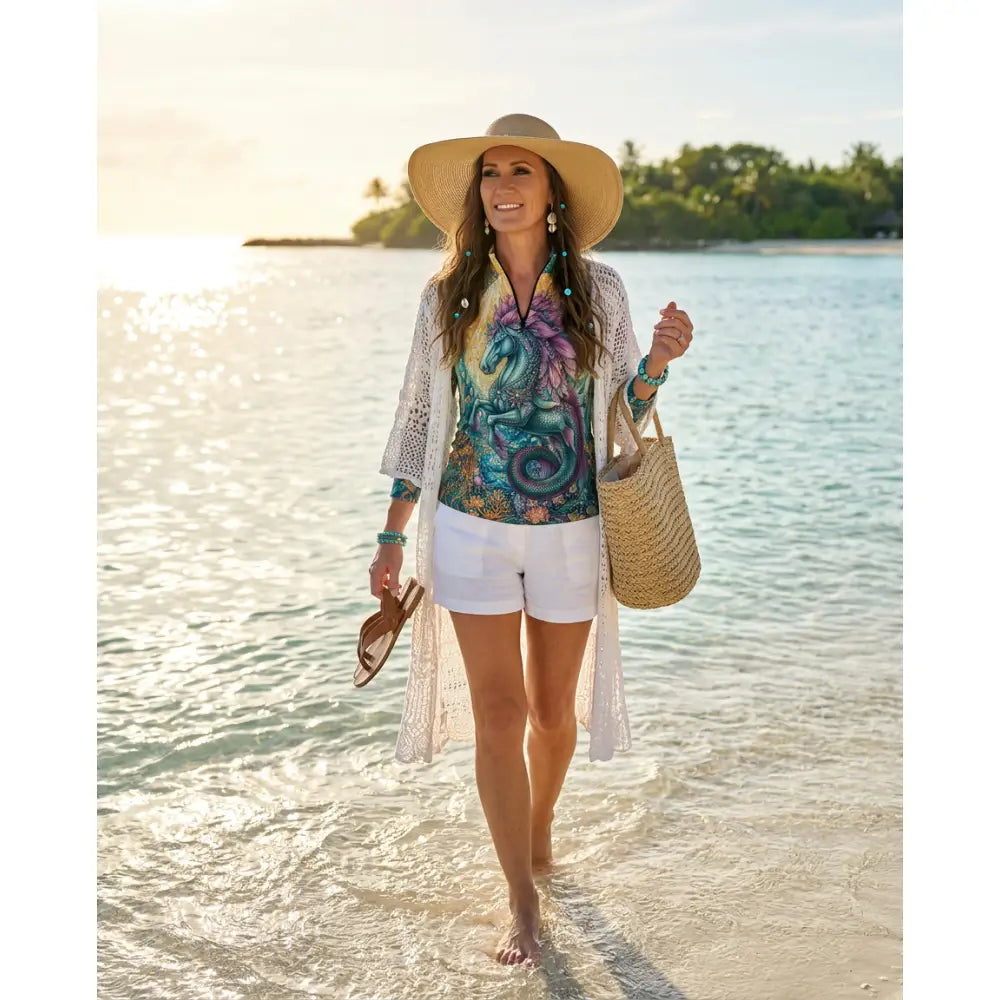Woman wearing tidewoven reefborn ocean reef print upf50+ equestrian sun shirt in wearable art performance apparel
