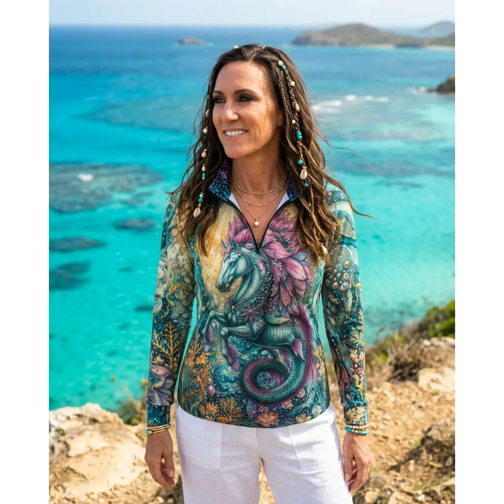 Vibrant long-sleeved zip-up tidewoven reefborn sun shirt with teal and purple sea unicorn design and upf50+ protection