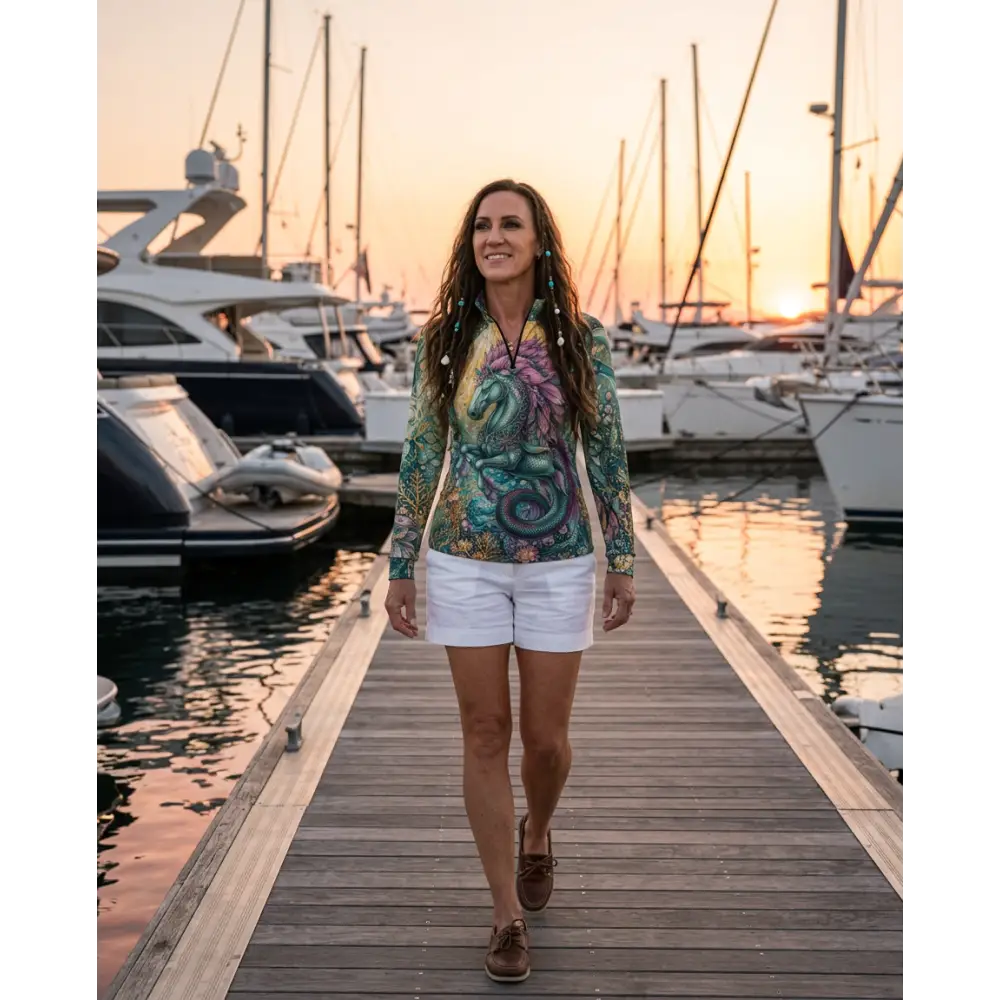 A vibrant tidewoven reefborn performance equestrian sun shirt with teal purple sea creature design and upf50+ protection