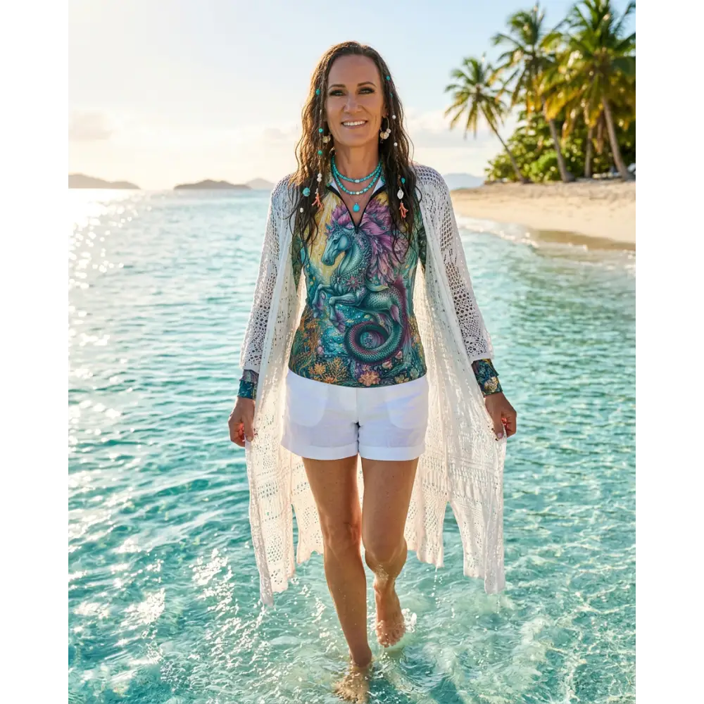 Woman wearing a colorful tidewoven reefborn performance equestrian sun shirt with upf50 plus and turquoise necklaces