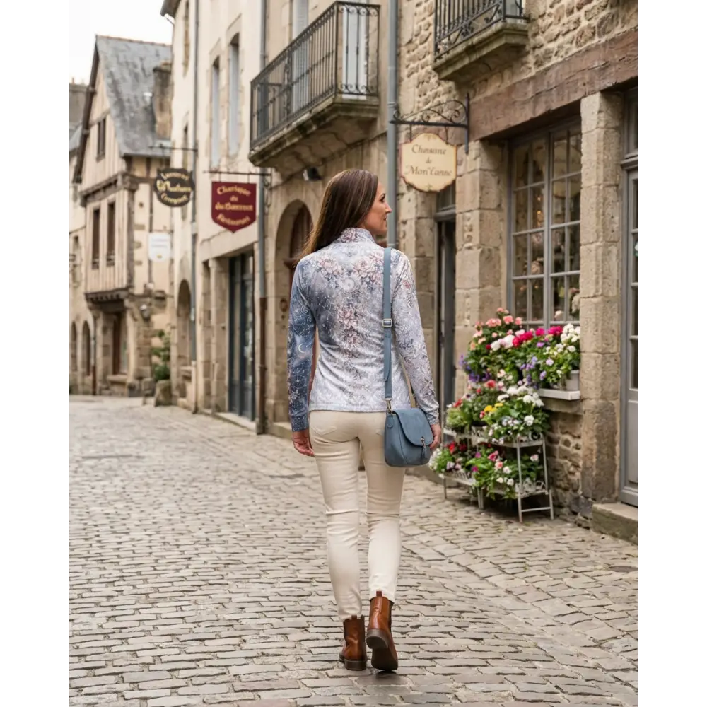 Blue crossbody bag with soft leather texture and minimalist design paired with unicornis caelestis performance equestrian sun shirt upf50+